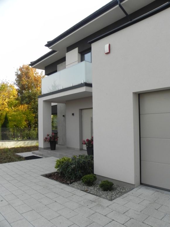 Projekt elewacji domu. nowoczesna elewacja. domu piętrowego.  realizacja projektu elewacji nowoczesnego domu 